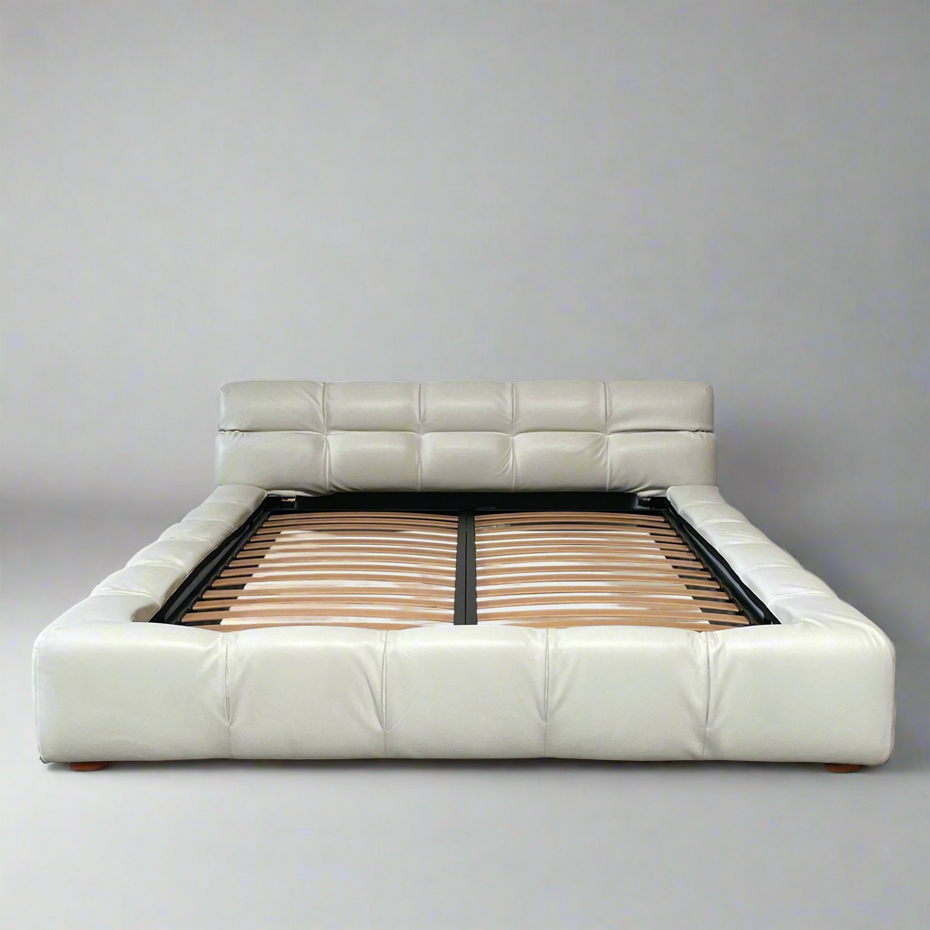 A B&B Italia Queen Sized Tufty Time Bed with wooden slats.