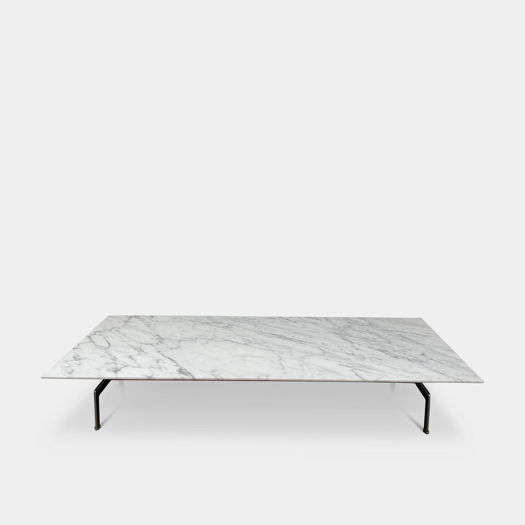 Enhance your living space with the timeless elegance of the B&B Italia Diesis Marble Coffee Table, featuring a sleek white marble top and slender black metal legs for a touch of sophistication.