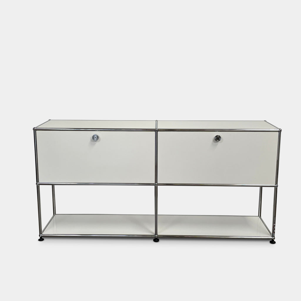 The modern USM Haller Open Credenza in white showcases two compartments with round metal handles and an open lower shelf for display, effortlessly combining functionality with contemporary design.