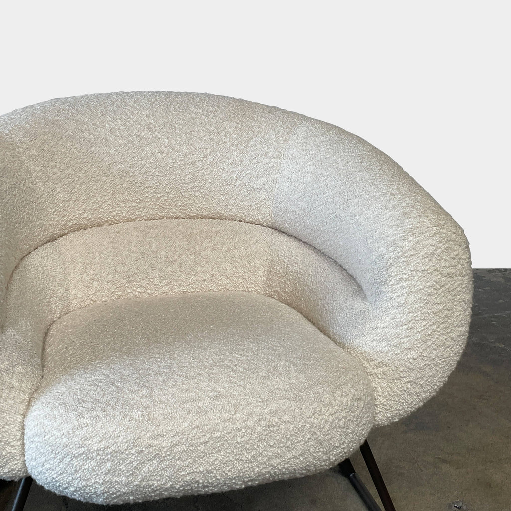 A pair of white Delcourt Collection DJE armchairs.