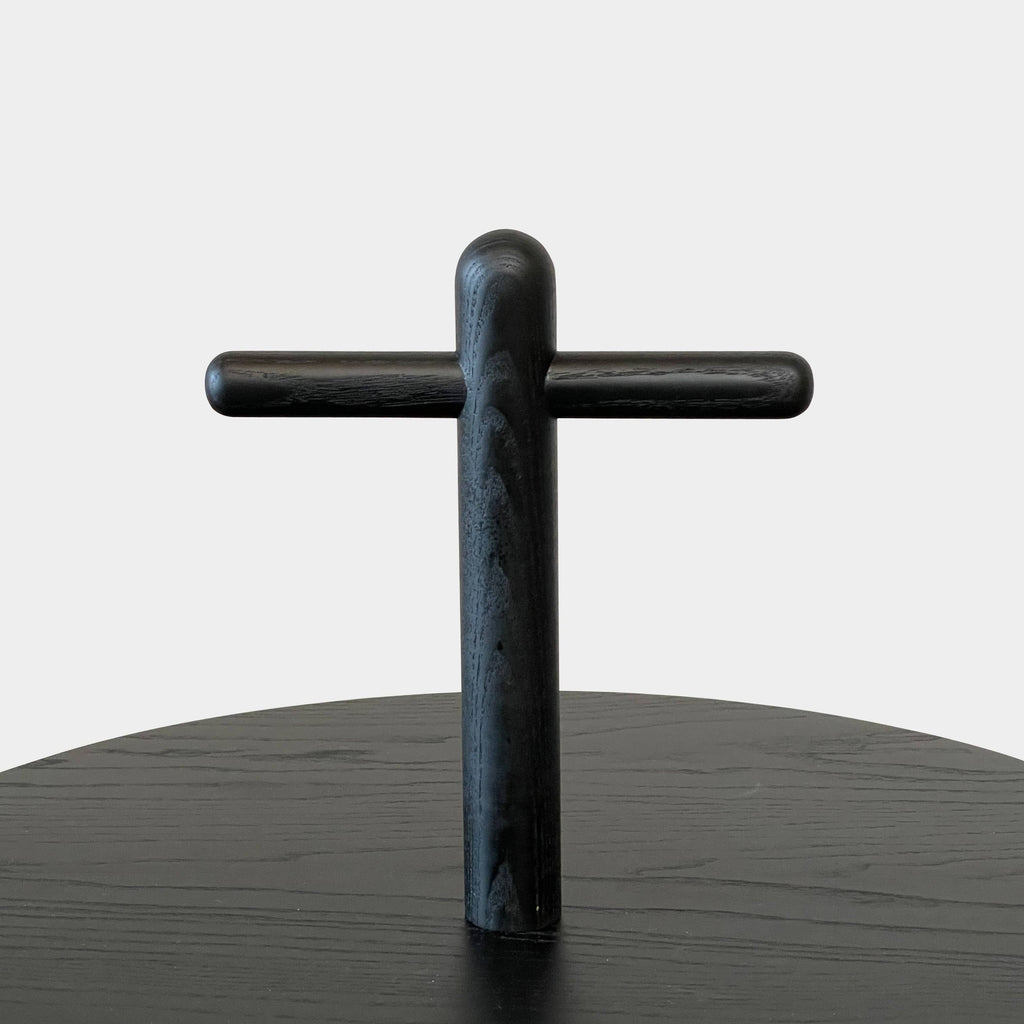 The Cassina Réaction Poétique Side Table logo is elegantly displayed on a sleek black surface.