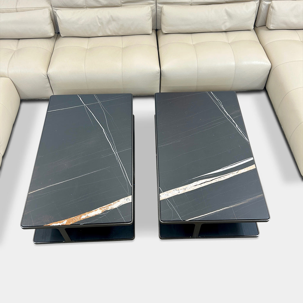 The Poliform Creek Marble Coffee Table is a rectangular Sahara Noir marble piece with a thin, horizontal design and subtle veining.