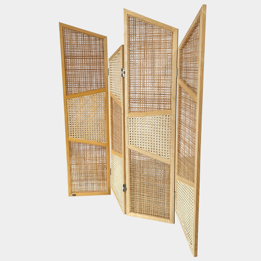 Close-up view of a wooden frame with a woven wicker panel, showcasing Lebanese craftsmanship. The wood shows a small patch of wear, offering a glimpse into the meticulous detailing associated with Nada Debs' contemporary Arabesque designs in the Nada Debs Summerland Folding Screen.