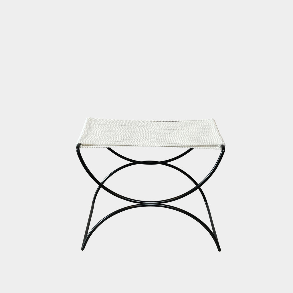 Two TEN10 Pompeii Low Outdoor Stools by TEN10 with mid-century modernist design feature curved black wrought iron bases and white, fabric-covered seats set against a plain white background.