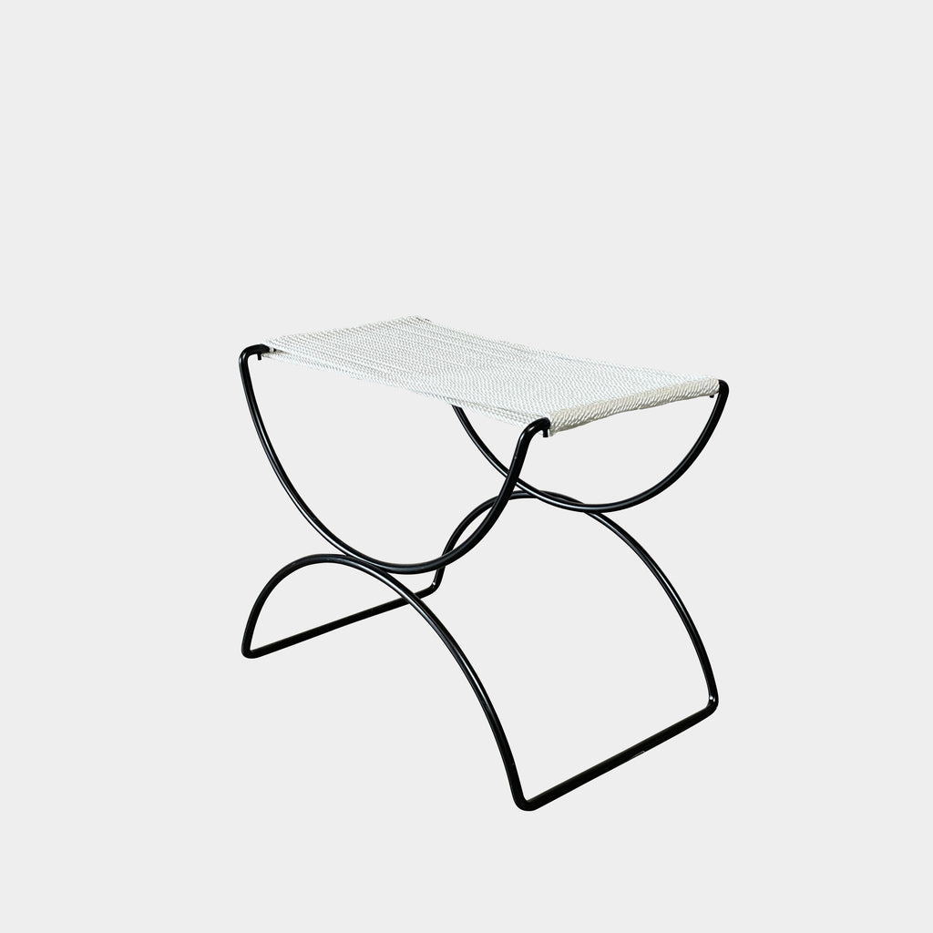 Two TEN10 Pompeii Low Outdoor Stools by TEN10 with mid-century modernist design feature curved black wrought iron bases and white, fabric-covered seats set against a plain white background.