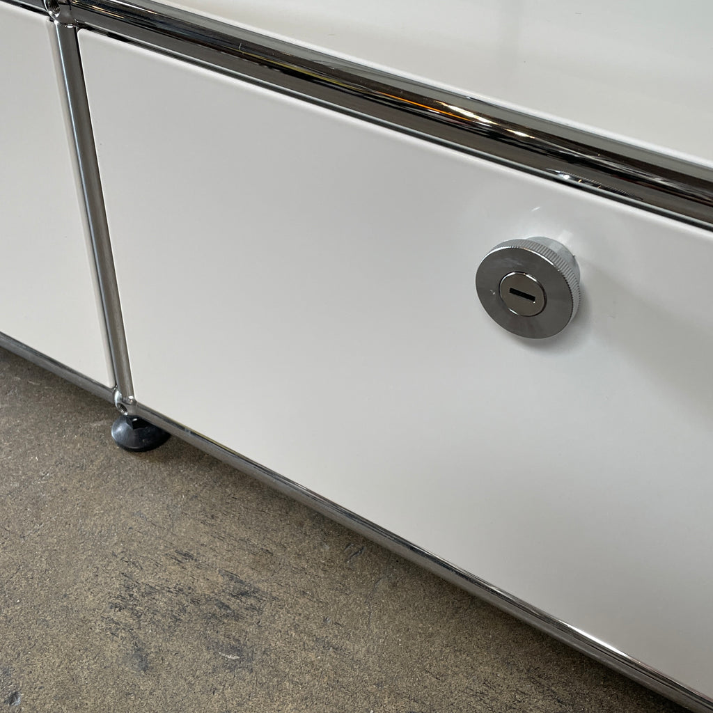 A USM Haller White Cabinet / Console with six compartments, featuring a minimalist design and a chromed steel frame, reminiscent of the USM Haller Office Cabinet.