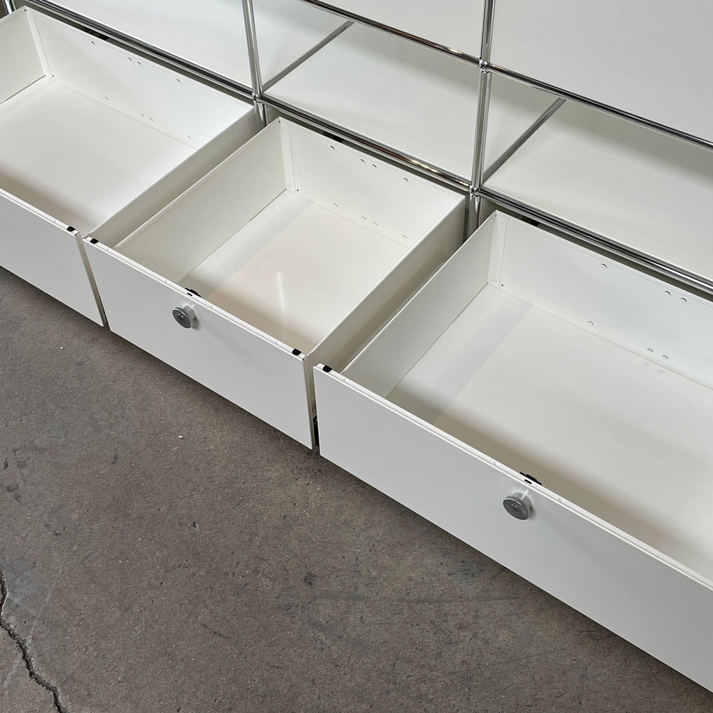 A USM Haller White Cabinet / Console with six compartments, featuring a minimalist design and a chromed steel frame, reminiscent of the USM Haller Office Cabinet.