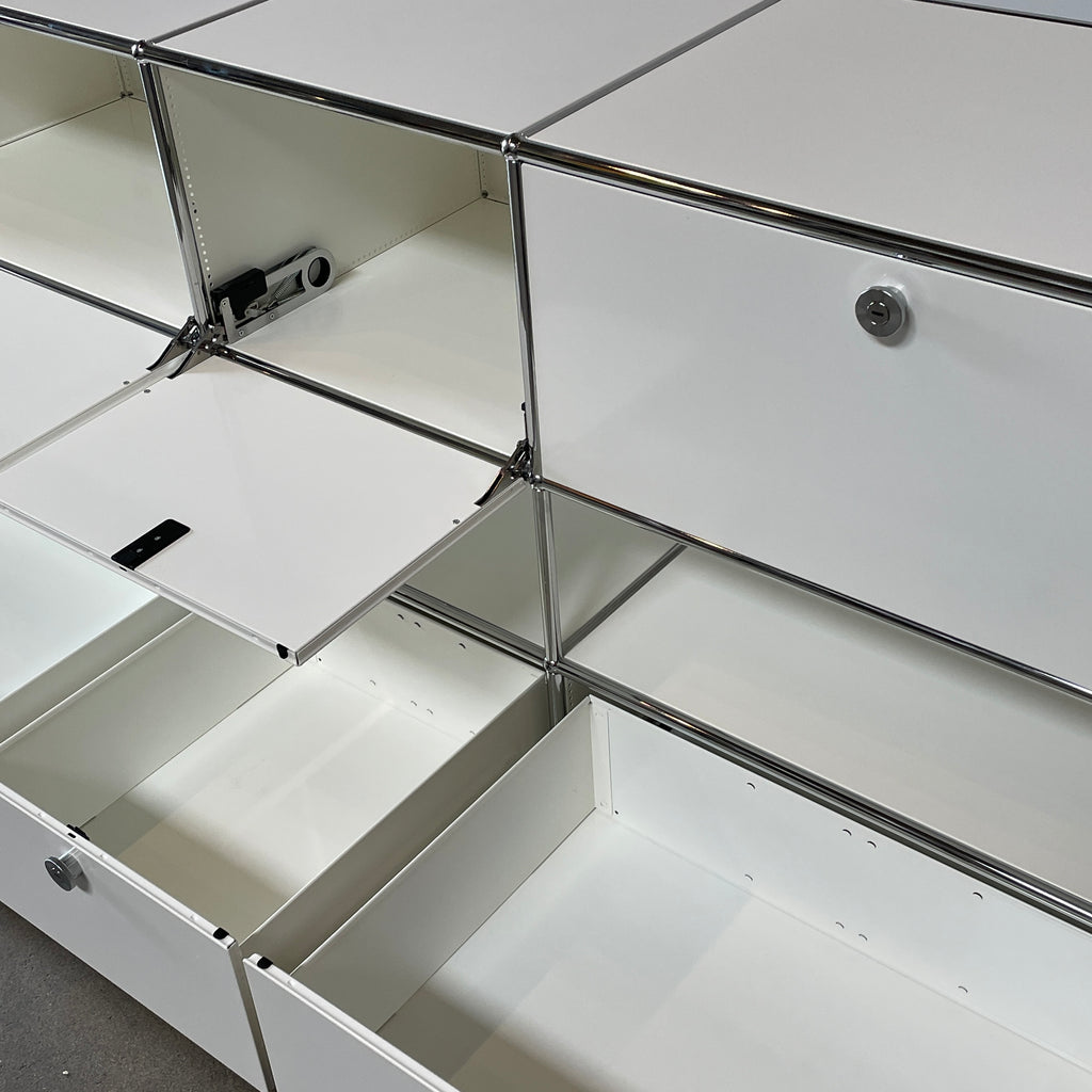 A USM Haller White Cabinet / Console with six compartments, featuring a minimalist design and a chromed steel frame, reminiscent of the USM Haller Office Cabinet.