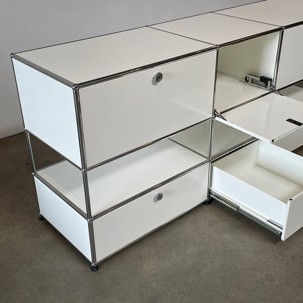 A USM Haller White Cabinet / Console with six compartments, featuring a minimalist design and a chromed steel frame, reminiscent of the USM Haller Office Cabinet.