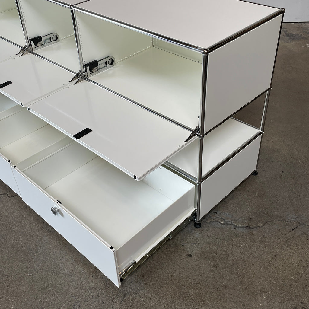 A USM Haller White Cabinet / Console with six compartments, featuring a minimalist design and a chromed steel frame, reminiscent of the USM Haller Office Cabinet.