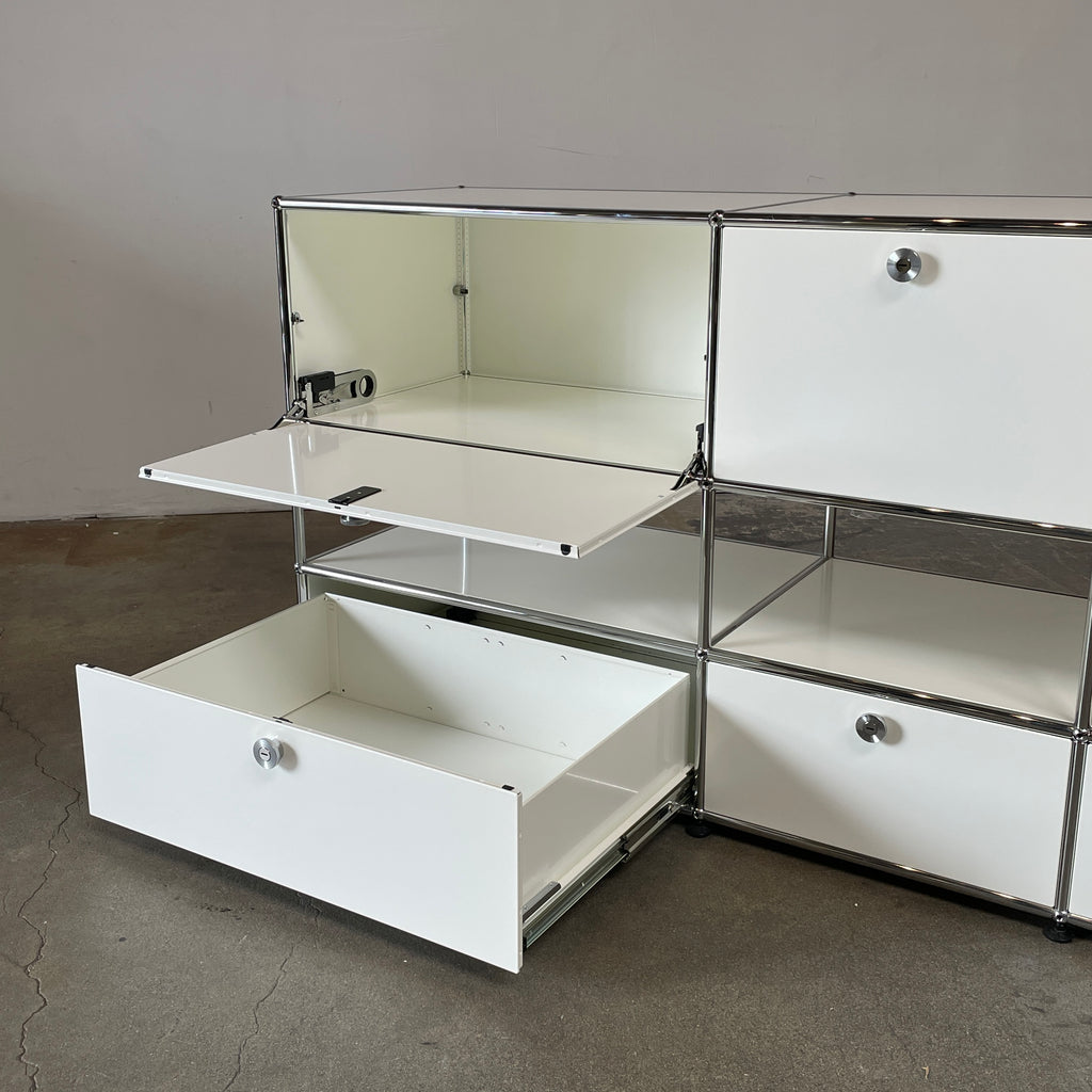 A USM Haller White Cabinet / Console with six compartments, featuring a minimalist design and a chromed steel frame, reminiscent of the USM Haller Office Cabinet.