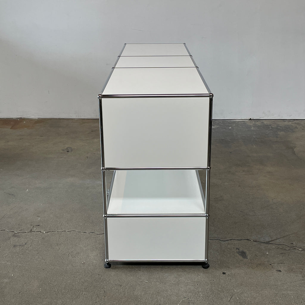 A USM Haller White Cabinet / Console with six compartments, featuring a minimalist design and a chromed steel frame, reminiscent of the USM Haller Office Cabinet.