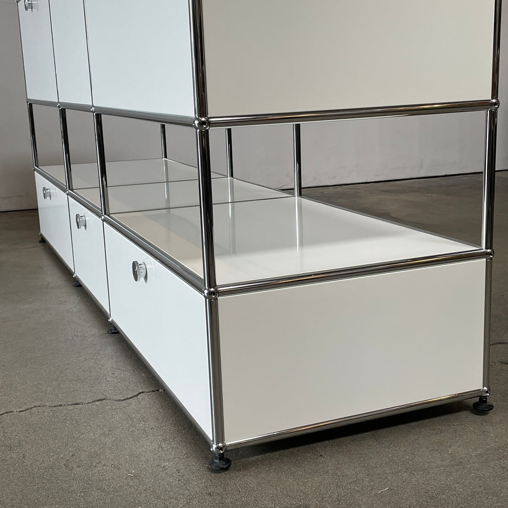 A USM Haller White Cabinet / Console with six compartments, featuring a minimalist design and a chromed steel frame, reminiscent of the USM Haller Office Cabinet.