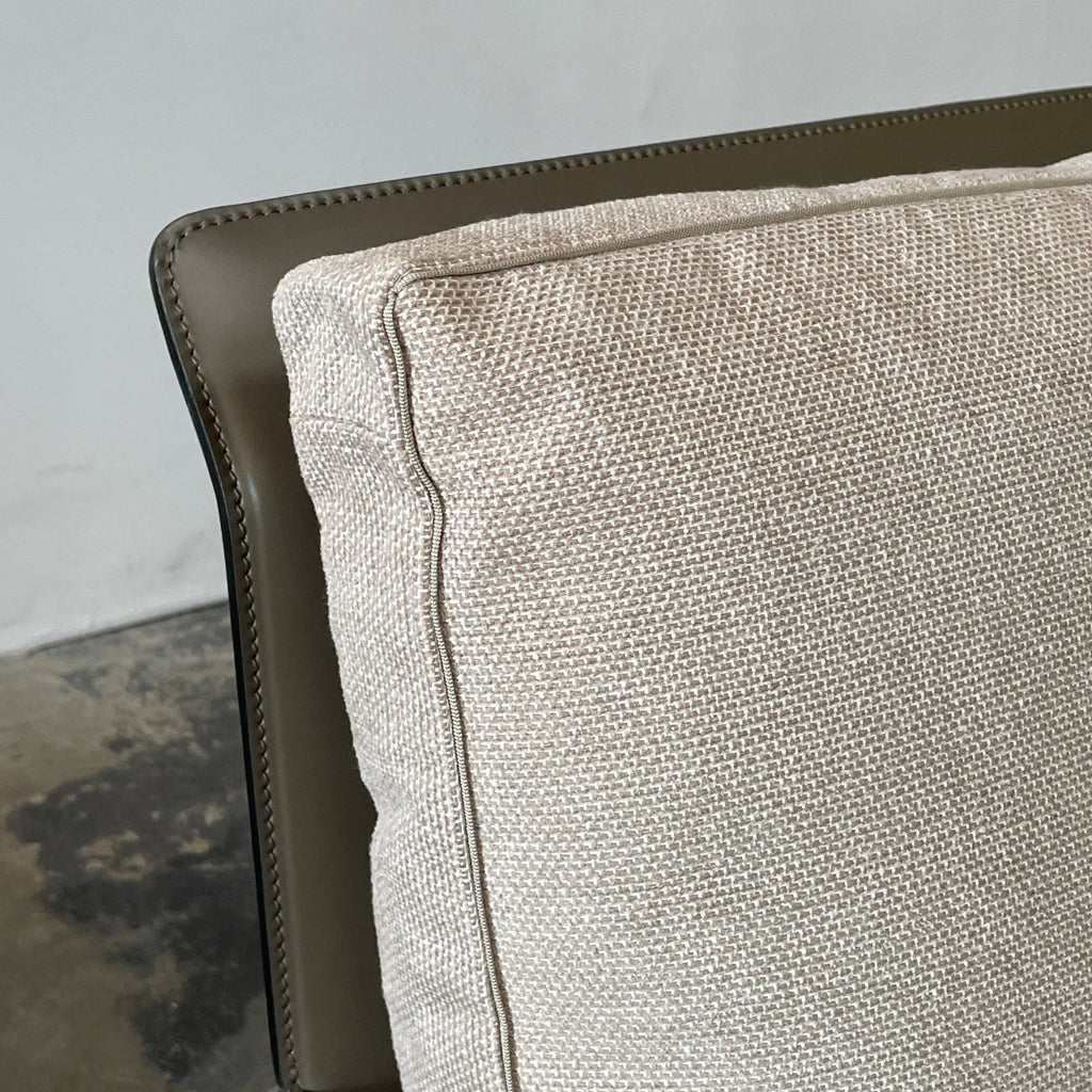 A Flexform Happy-Hour Lounge Chair with a gray cushioned seat, black metal frame, and angled legs is shown against a white background.