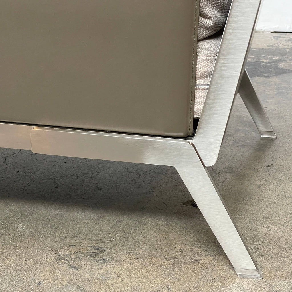 A Flexform Happy-Hour Lounge Chair with a gray cushioned seat, black metal frame, and angled legs is shown against a white background.