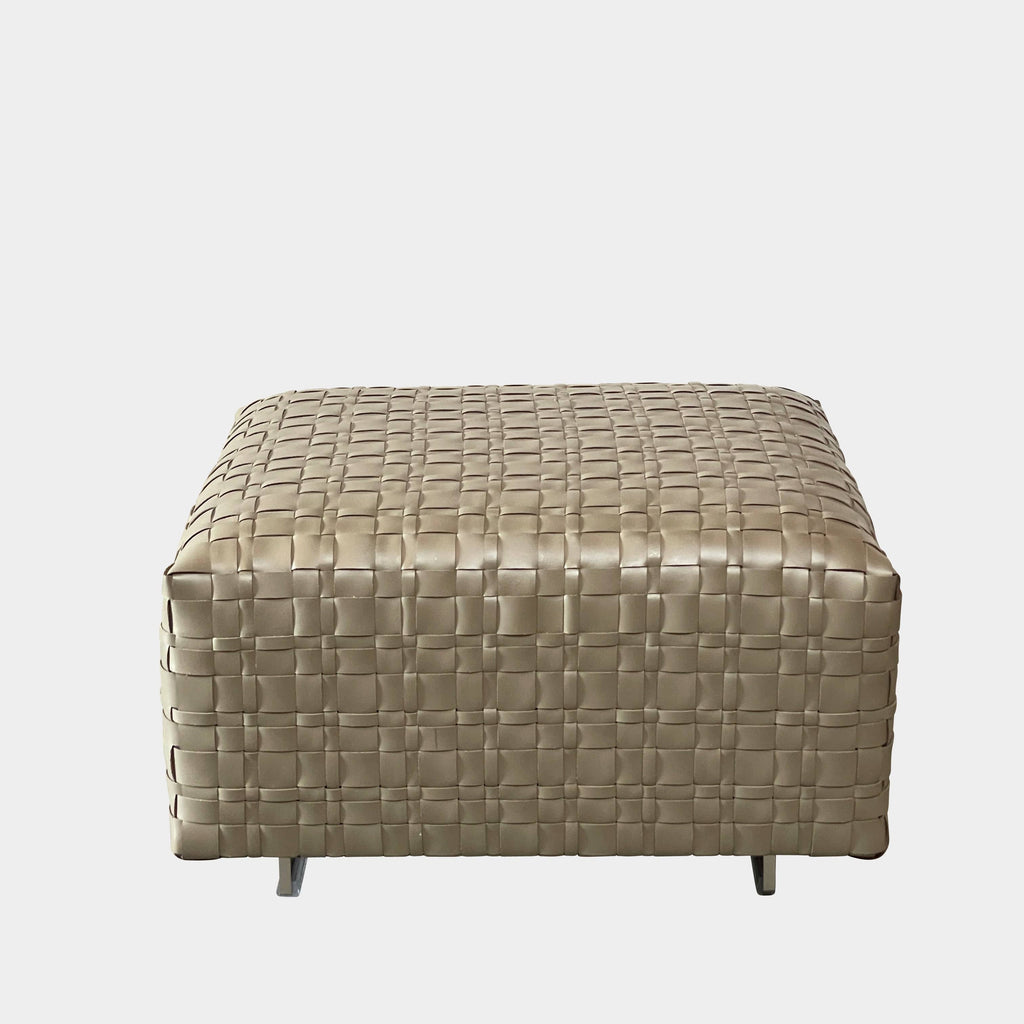 A square, beige Flexform Bangkok Ottoman with a woven leather pattern and four short metal legs evokes the stylish charm of Bangkok.
