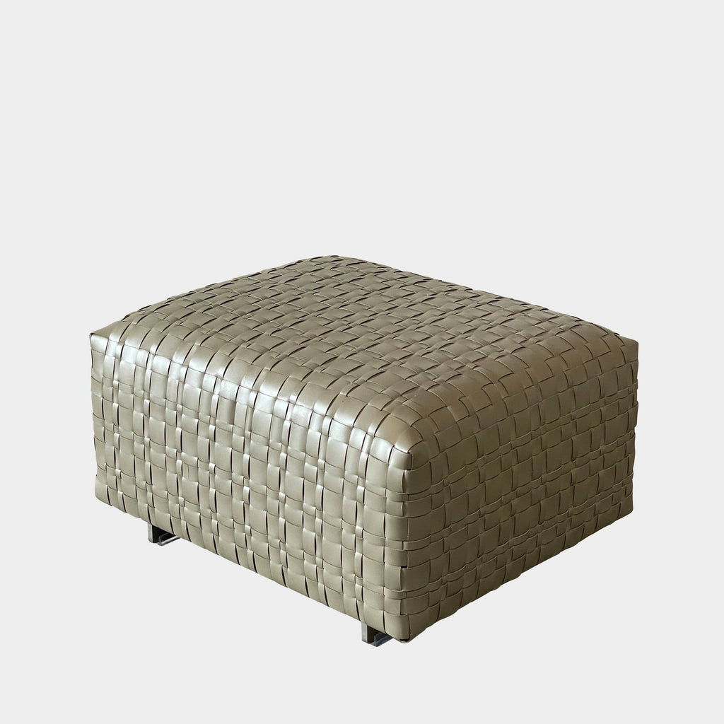 A square, beige Flexform Bangkok Ottoman with a woven leather pattern and four short metal legs evokes the stylish charm of Bangkok.