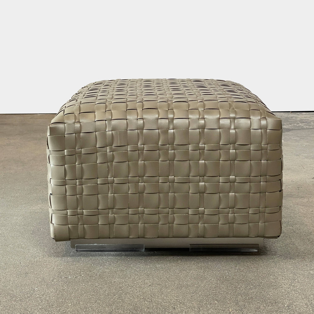 A square, beige Flexform Bangkok Ottoman with a woven leather pattern and four short metal legs evokes the stylish charm of Bangkok.