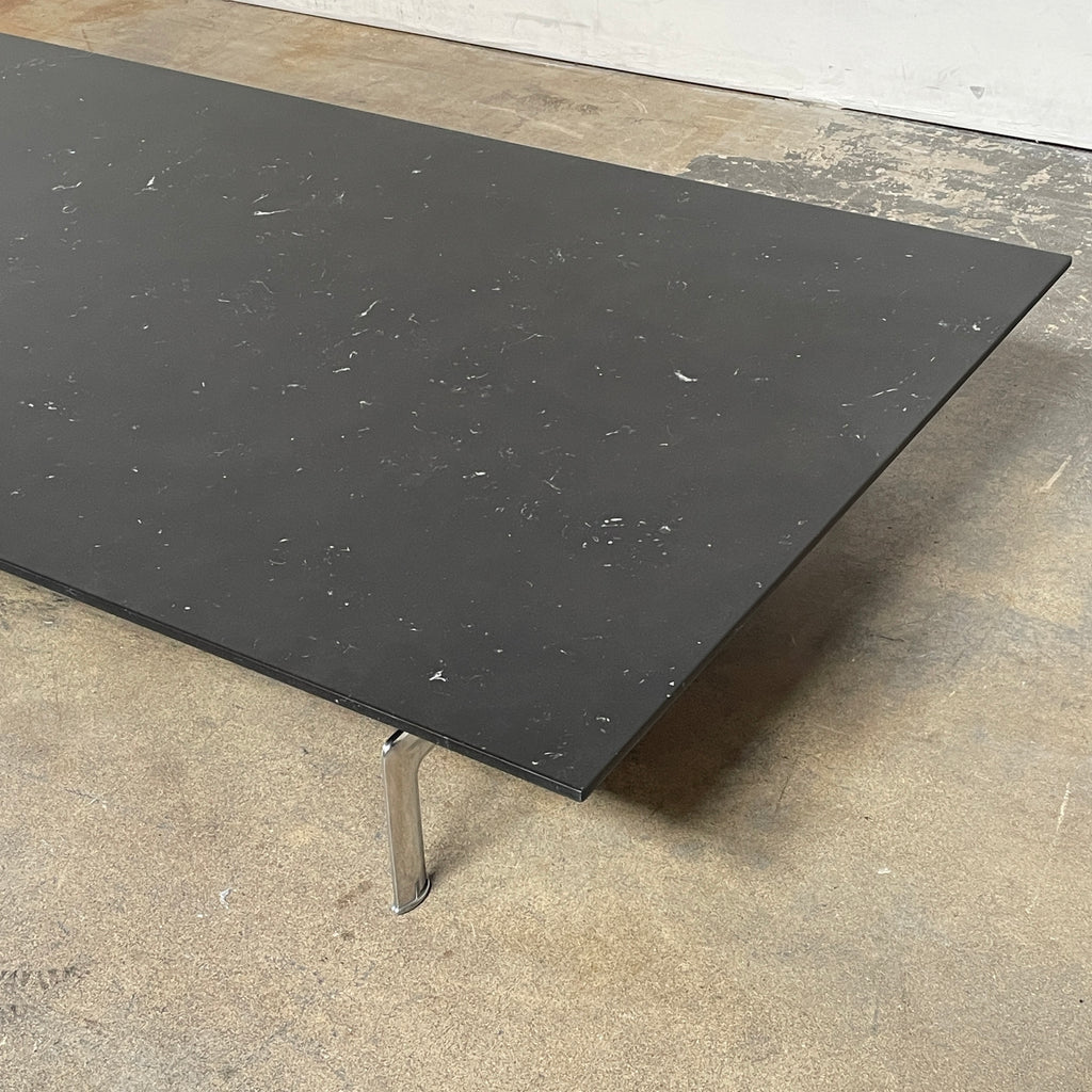 A minimalist rectangular black B&B Italia Diesis Coffee Table with metal legs, viewed directly from above, exudes timeless beauty against a plain white background.