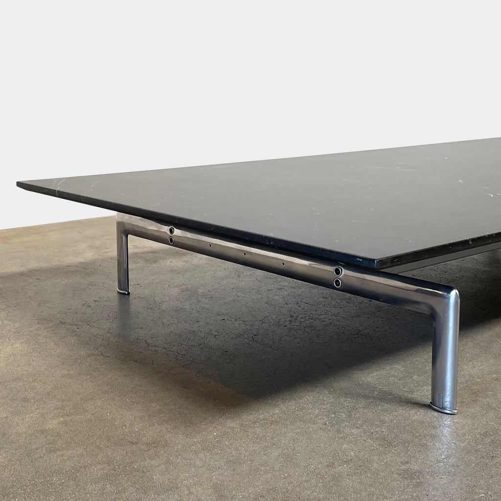 A minimalist rectangular black B&B Italia Diesis Coffee Table with metal legs, viewed directly from above, exudes timeless beauty against a plain white background.