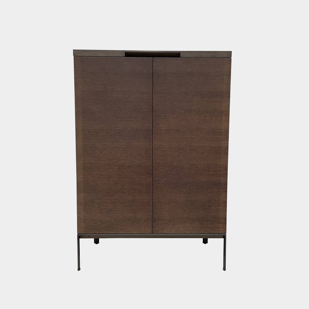 A Maxalto Mida High Cabinet featuring a brown wooden finish, two doors, and black metal legs stands elegantly against a white background.