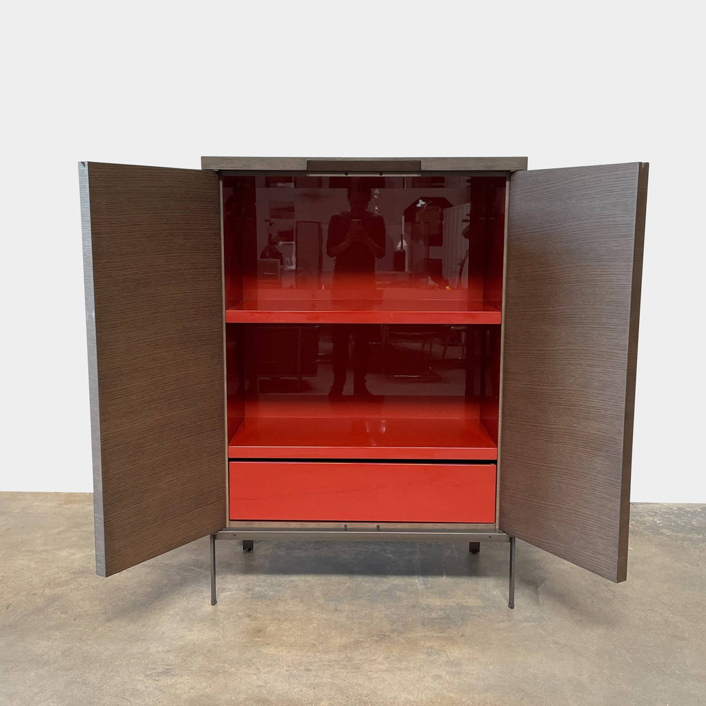 A Maxalto Mida High Cabinet featuring a brown wooden finish, two doors, and black metal legs stands elegantly against a white background.