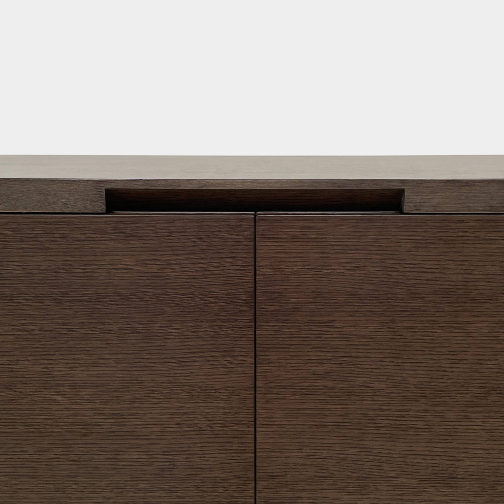 A Maxalto Mida High Cabinet featuring a brown wooden finish, two doors, and black metal legs stands elegantly against a white background.