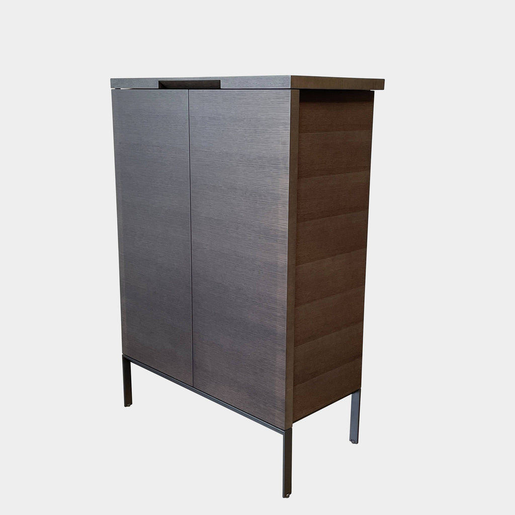 A Maxalto Mida High Cabinet featuring a brown wooden finish, two doors, and black metal legs stands elegantly against a white background.