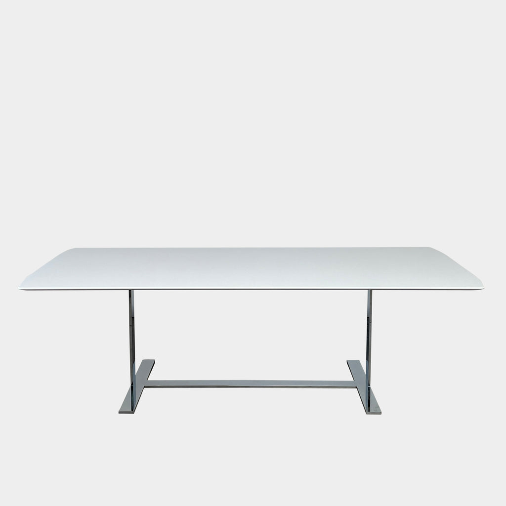 A minimalist rectangular B&B Italia Eileen White Dining Table featuring a sophisticated T-shaped metal base on a plain white background.