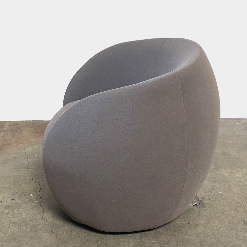 Two Roche Bobois Dot Chairs from the prestigious Roche Bobois brand, featuring a sleek grey and modern curved design, are positioned on a plain, light background. One chair faces forward while the other showcases its side profile, enhancing their sophisticated allure.