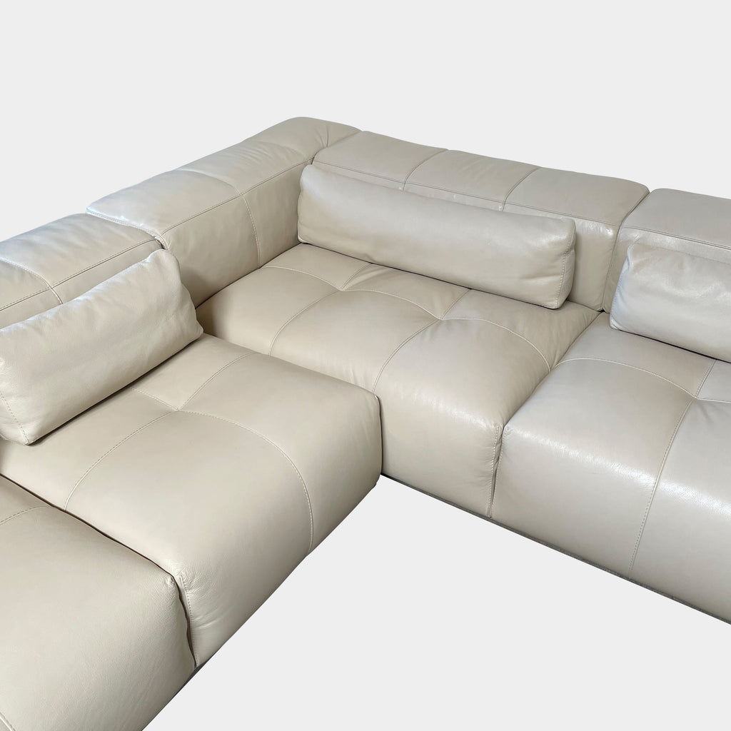 A large beige L-shaped Functions Nick Sectional sofa from the Functions brand, featuring cushioned seats and backs, is viewed against a plain white background.