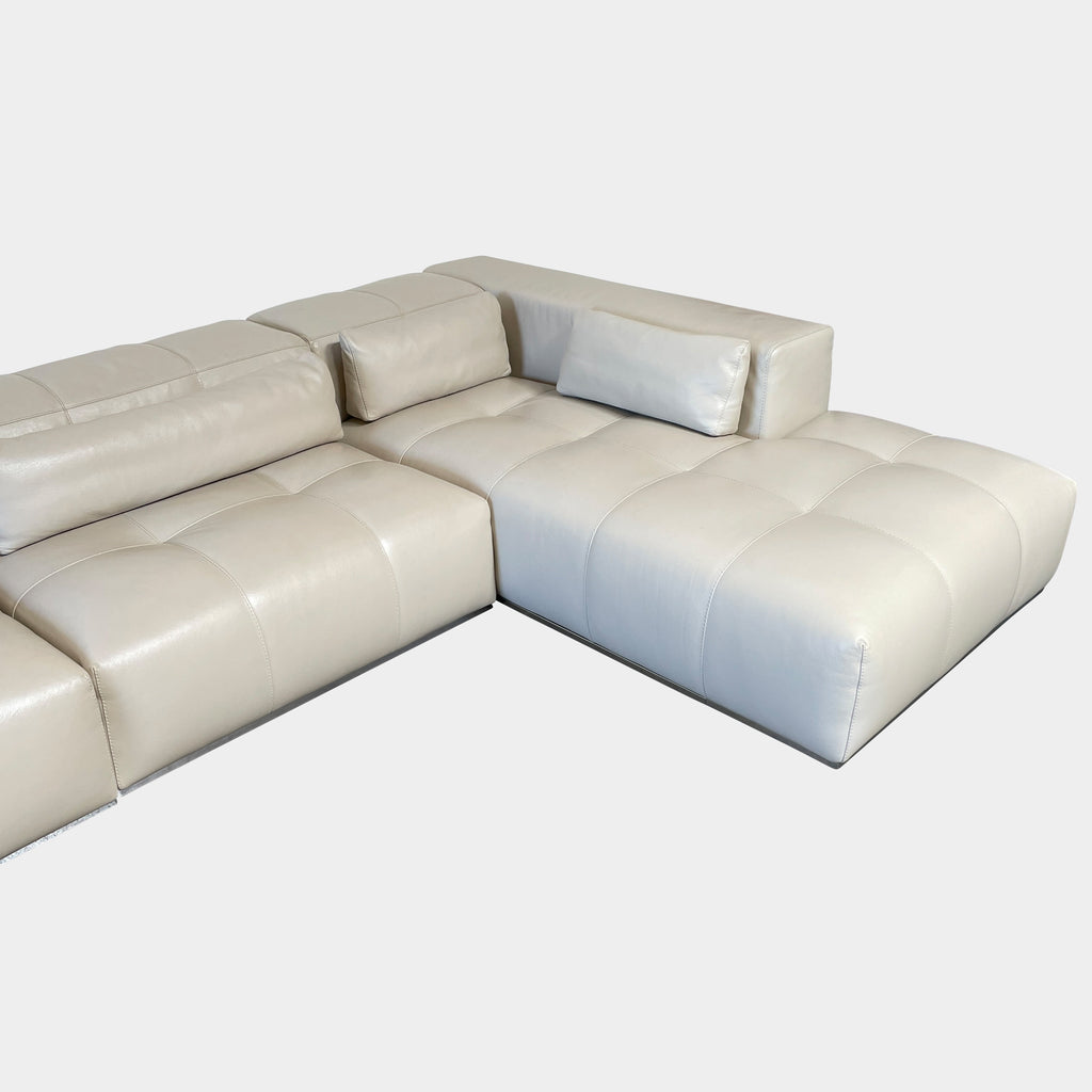 A large beige L-shaped Functions Nick Sectional sofa from the Functions brand, featuring cushioned seats and backs, is viewed against a plain white background.