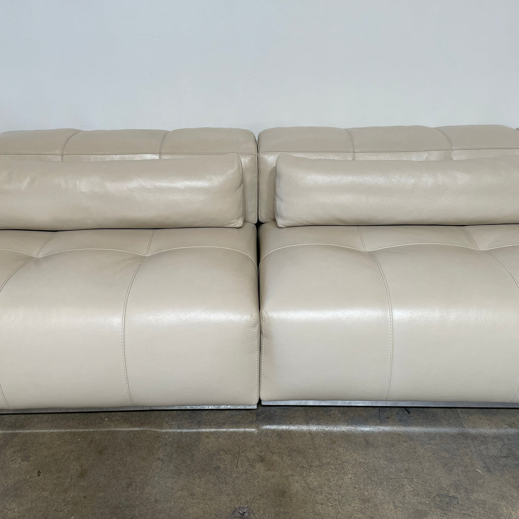 A large beige L-shaped Functions Nick Sectional sofa from the Functions brand, featuring cushioned seats and backs, is viewed against a plain white background.