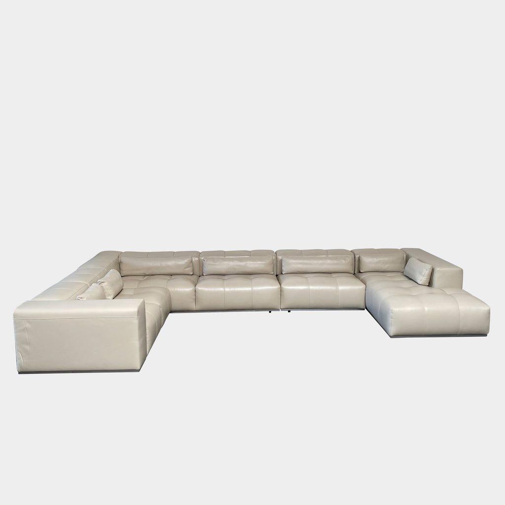 A large beige L-shaped Functions Nick Sectional sofa from the Functions brand, featuring cushioned seats and backs, is viewed against a plain white background.