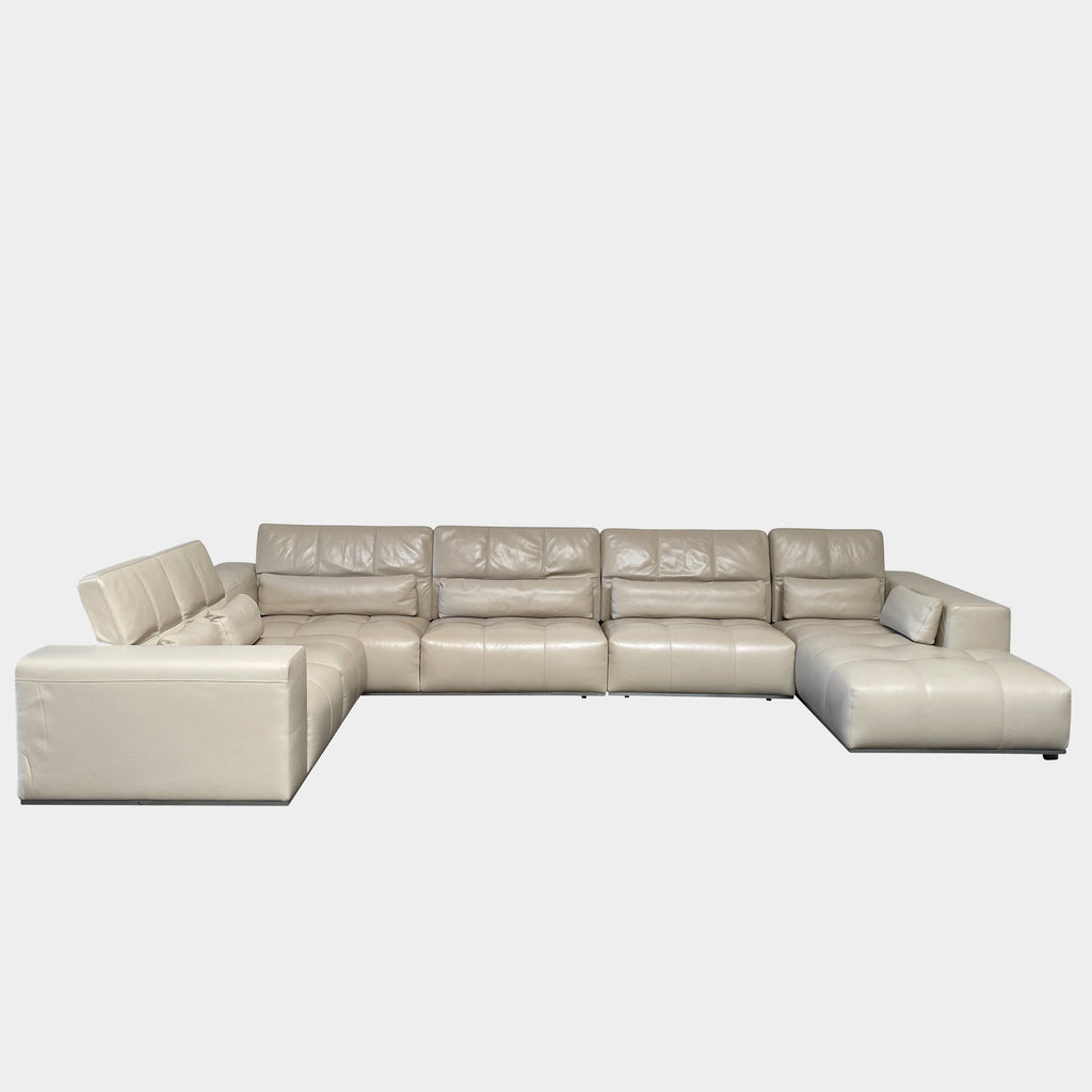 A large beige L-shaped Functions Nick Sectional sofa from the Functions brand, featuring cushioned seats and backs, is viewed against a plain white background.