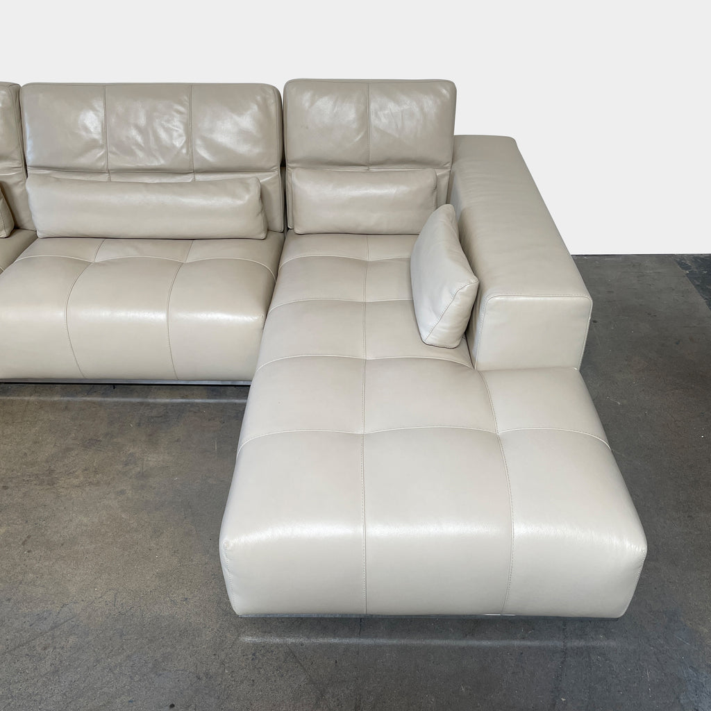 A large beige L-shaped Functions Nick Sectional sofa from the Functions brand, featuring cushioned seats and backs, is viewed against a plain white background.