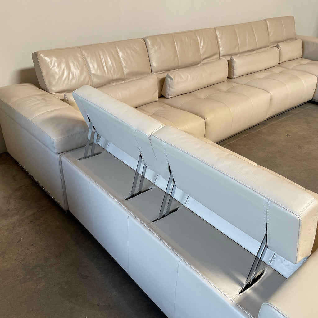 A large beige L-shaped Functions Nick Sectional sofa from the Functions brand, featuring cushioned seats and backs, is viewed against a plain white background.