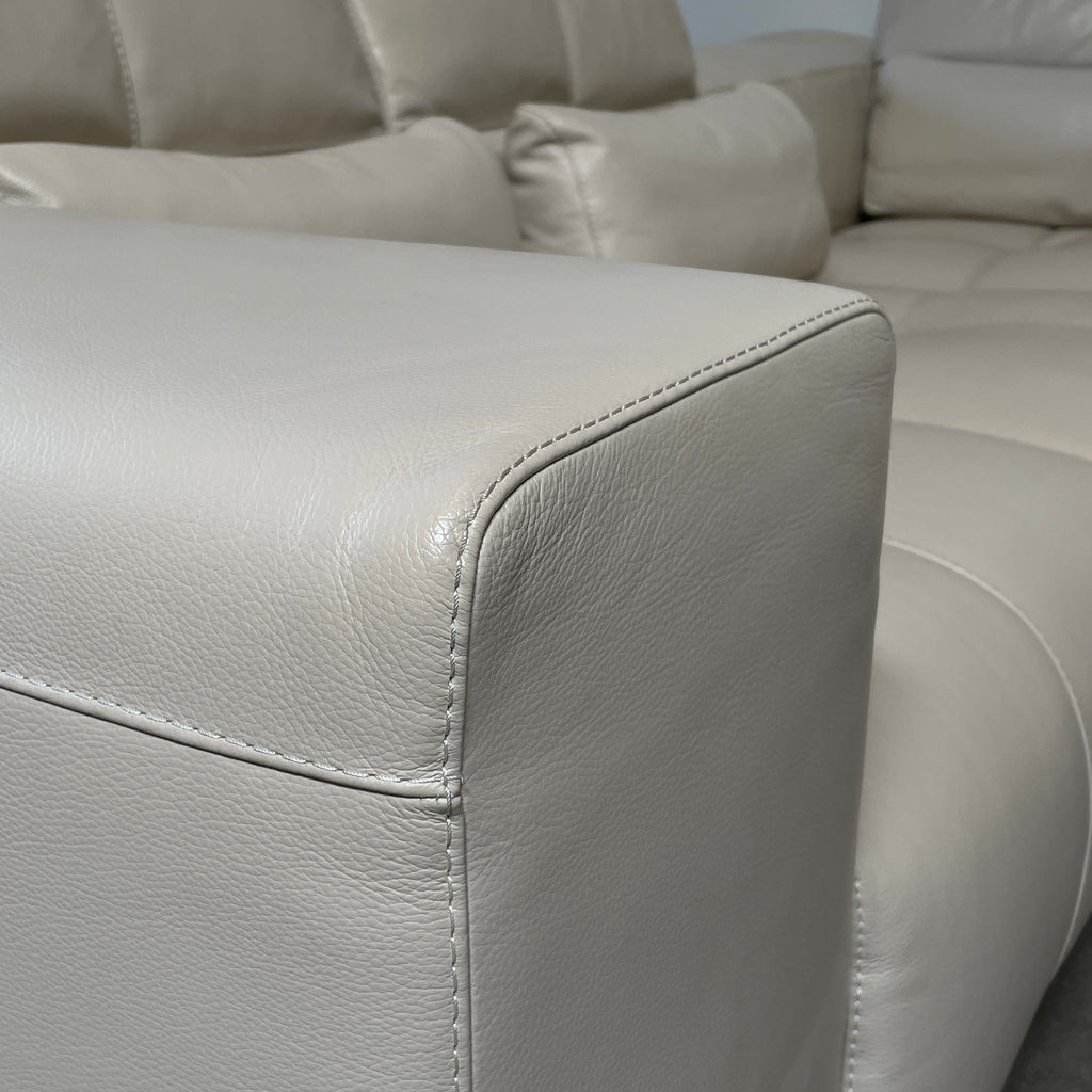 A large beige L-shaped Functions Nick Sectional sofa from the Functions brand, featuring cushioned seats and backs, is viewed against a plain white background.