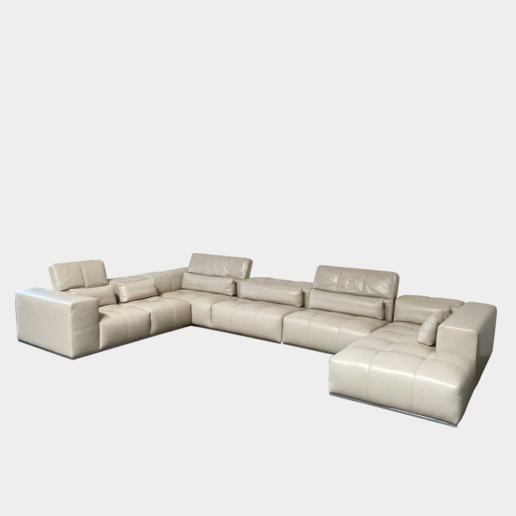 A large beige L-shaped Functions Nick Sectional sofa from the Functions brand, featuring cushioned seats and backs, is viewed against a plain white background.