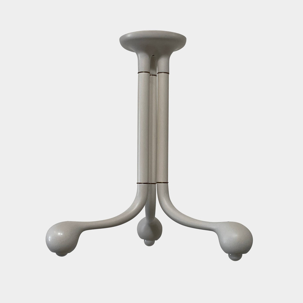 A three-legged white plastic stool with rounded feet and a smooth, minimalistic design, reminiscent of the sleek aesthetics seen in the Entler Studio 3-Globe Chandelier G Light Matte White.