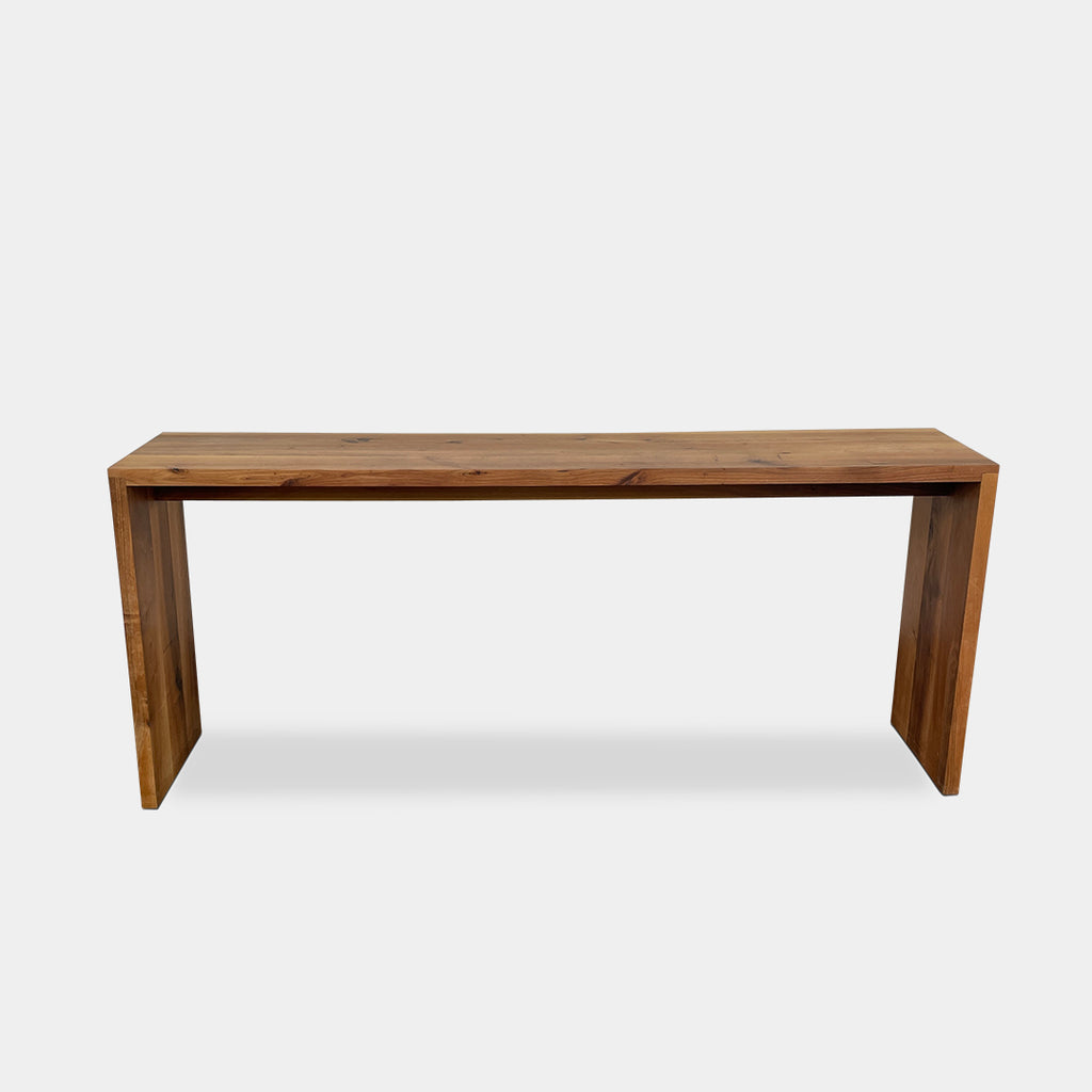 The e15 Ponte Oak High Table from the brand e15 is a simple wooden piece crafted from solid oak, featuring clean lines and a natural finish, enhanced by distinctive corner joints.